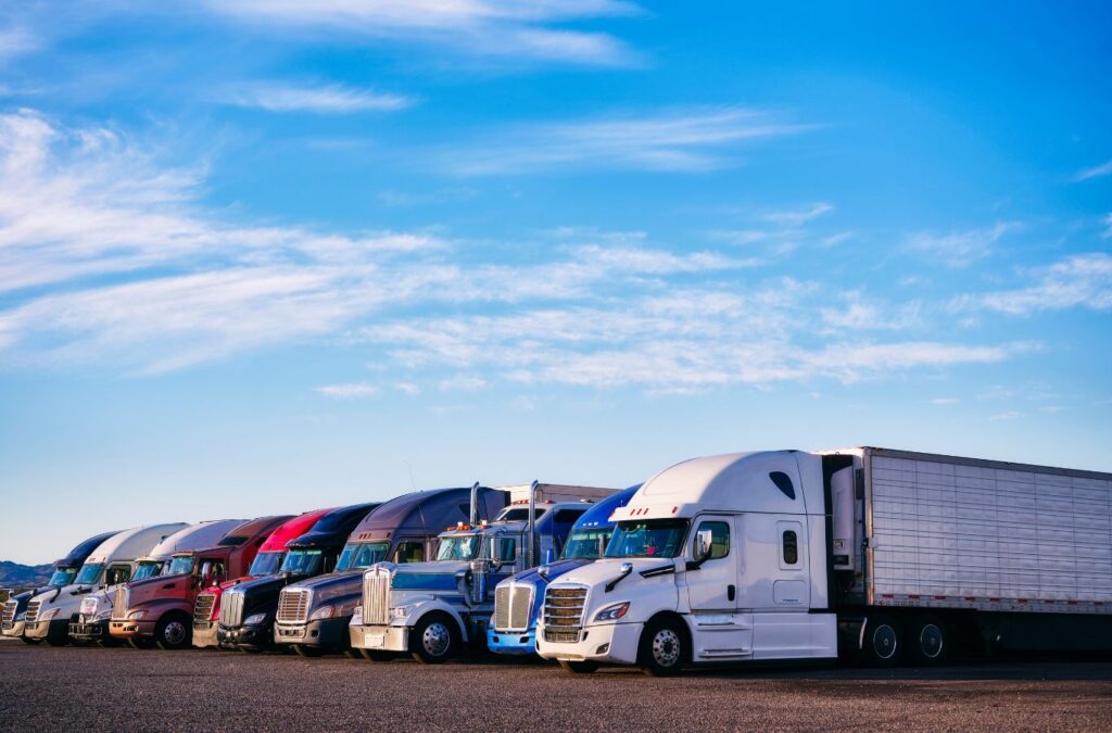 A fleet of trucks ready for DEF Delivery by Exhaustfluid, ensuring efficient operations with high-quality Diesel Exhaust Fluid supply.