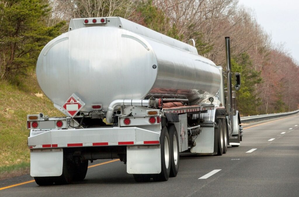 A Exhaustfluid team member delivering DEF in Essex County, MA, demonstrating the benefits of using a local professional for this essential service.