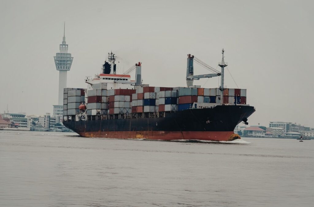 Marine crew coordinating AUS40 delivery beside service vessel during scheduled maintenance stop